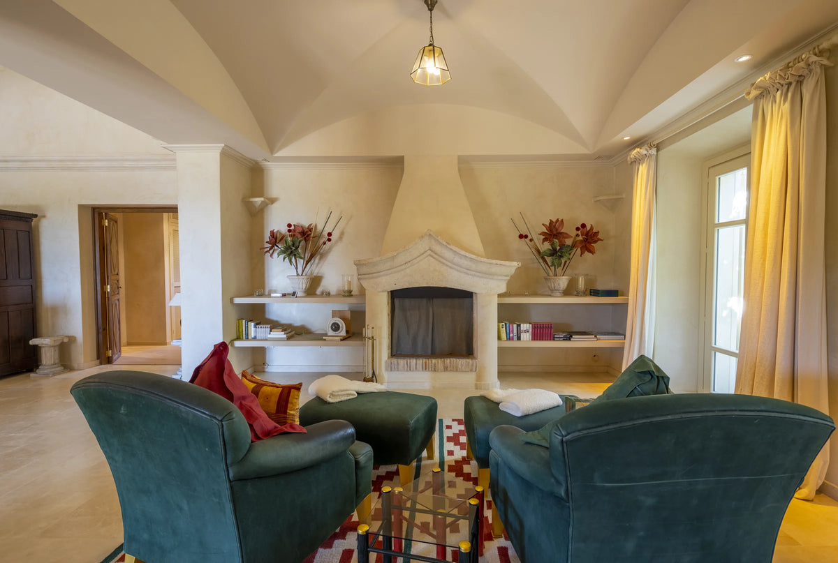 Living room with stone fireplace in the Mallorcan House